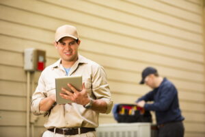 technicians-work-on-an-outdoor-compressor-unit