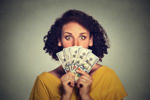 person-with-fanned-out-money